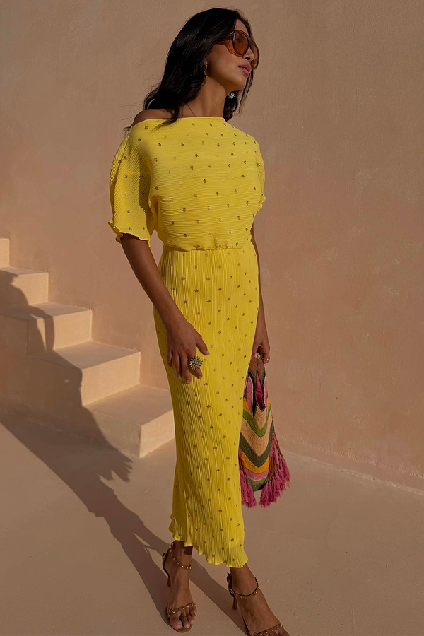 Yellow plissé Lemon Tilly Dress with metallic gold spots, off-the-shoulder neckline and a pleated midaxi skirt.