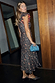 Cherry Leopard Remi Dress with ruffled sleeves and an asymmetrical skirt, featuring red cherry motifs on leopard print.