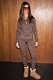 Leopard print thermal leggings and matching top styled with orange ski goggles and shearling-lined boots.