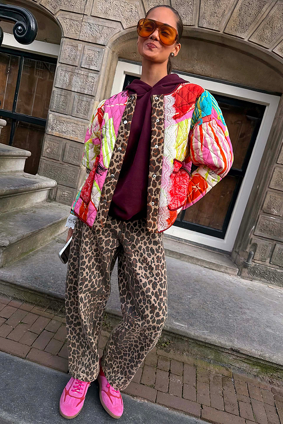 Iconic Leopard Barrel Jeans in a relaxed barrel leg shape, styled with a colourful quilted jacket.