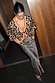 Thumbnail for Cherry Leopard knit cardigan with red trims and cherry motifs, styled with a matching leopard print maxi skirt.