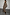 Thumbnail for Lucia Leopard Denim 55 Coat Petite in iconic leopard print stretch denim, with a tie waist and front pockets.