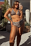 Thumbnail for Leopard high-waist bikini bottoms with blue whipstitch trim, styled on a model for an inclusive vacation look.