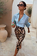 Brown Leopard Jaspre Skirt in satin with an adjustable wrap, paired with a light blue button-down shirt.