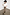 Thumbnail for Wide-leg Leopard Lucia Scallop Detail Jeans styled with a white V-neck tee and black hat.