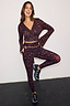 Dark Leopard Leggings in a compressive stretch fabric with a matching wrap top in an iconic animal print.