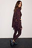 Dark Leopard Leggings with orange detailing and a matching leopard print wrap top with wide sleeves.