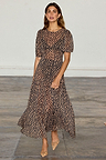 Leopard Lucia Dress featuring a sheer leopard print, voluminous puff sleeves and a tiered drop waist.