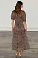 Thumbnail for Leopard Lucia Dress in sheer animal print with puff sleeves and a tiered skirt, shown from the back.