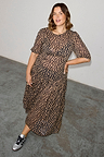 Sheer Leopard Lucia midaxi dress with puff sleeves and tiered skirt, highlighting inclusive sizing.