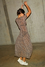 Thumbnail for Leopard Lucia sheer maxi dress in iconic leopard print with a low waistline and pleated bust, styled with white trainers.