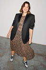 Leopard Lucia sheer dress styled with a black blazer and silver trainers, highlighting inclusive sizing in UK 18.