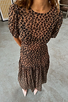 Sheer Leopard Lucia Dress featuring puff sleeves and a tiered skirt in an iconic leopard print.
