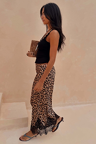 Leopard Lace Midi Maeva Skirt with a black lace border, styled with a black tank top and kitten heels.