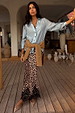 Iconic Leopard Lace Midi Maeva Skirt with a black lace hem, styled with a blue shirt and tied tan jumper.