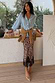 Leopard Lace Midi Maeva Skirt with a black lace hem, styled with a light blue shirt and tan knit.