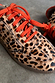 Leopard Pony Trainer featuring an iconic leopard print leather upper and contrasting orange laces.