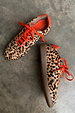 Leopard Pony Trainers featuring contrast orange laces and a gum sole in an iconic leopard print.
