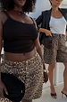 Leopard Lucia Scallop Pocket Long Shorts in brown denim, styled on two models for inclusive sizing.