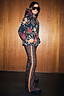 Leopard Ski Trousers featuring an orange side stripe and high waist, styled with a multi-print jacket.