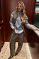 Iconic cotton Leopard Waistcoat layered over a grey jumper and matching barrel jeans for a statement London look.