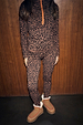 Leopard Thermal Leggings and matching zip-up top with orange trim, styled with shearling boots for a cosy ski base layer.