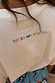 White Life Is Tough T-Shirt back detail featuring colourful 'BUT SO ARE YOU' embroidery and a tonal logo.