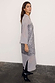 Gunmetal Sequin Lila Shirt Dress featuring silver sequins and sheer panels, styled with black pointed boots.