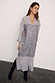 Gunmetal Sequin Lila Shirt Dress with shimmering silver sequins and sheer grey fabric, styled with black boots.