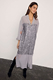 Gunmetal Sequin Lila Shirt Dress with shimmering silver sequins and sheer grey fabric, styled with black boots.