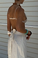 White Linen Jaspre Skirt featuring a wrap tie waist fastening, styled with a sequin bikini top.