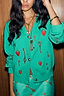 Thumbnail for Turquoise Key Cardigan in a soft touch knit with a hand-painted lock and key print, worn with a matching skirt.