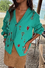 Turquoise Key Cardigan with hand-painted lock and key motifs, shown in a boxy knit fit for dopamine dressing.