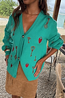 Turquoise Key Cardigan with hand-painted lock and key motifs, shown in a boxy knit fit for dopamine dressing.