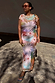 Abstract Soleil Luna Mesh Dress in a multicoloured soleil print mesh, shown on a model for a vacation look.