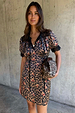 Cherry Leopard Mini Lyla Dress featuring black lace trims, ribbon ties, and cherry leopard print, designed in London.