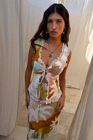 Abstract Soleil Maisie Top with sun motifs, white lace trim and a tie-front fastening.