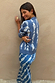 Blue Marina Hollie Cardigan with white fish motifs on a soft knit, styled with a matching co-ord skirt.