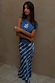 Blue Marina A-Symmetric Top with white fish motifs and a gathered waist, paired with a matching printed skirt.