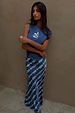 Blue Marina A-Symmetric Top with white fish motifs and a gathered waist, paired with a matching printed skirt.