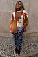 Cowgirl Martha Cardigan in tan knit with red contrast trim and a vintage western yoke with embroidered cowgirl motifs.