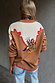 Cowgirl Martha Cardigan in tan with an embroidered western motif, cream contrast yoke and red stitching.