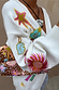 Dreamer Martha Cardigan in cream soft-touch knit with colourful embroidered sun and star motifs and a ribbed cuff.