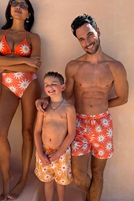 Men's Orange Sun Swim Shorts featuring the Soleil print, styled for a family matching vacation look.