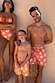 Men's Orange Sun Swim Shorts featuring the Soleil print, styled for a family matching vacation look.
