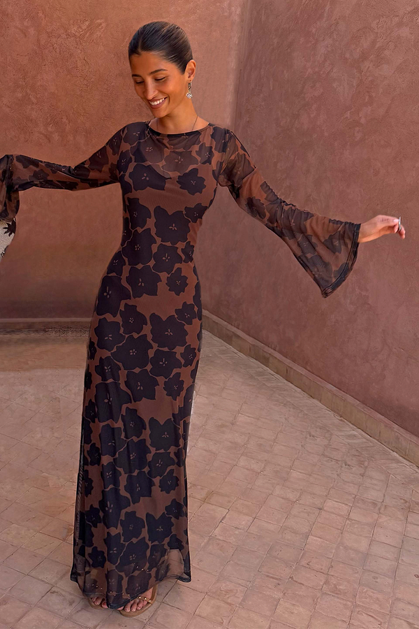 Tan Jaden Floral Mesh Dress with long flared sleeves and high neckline on a model.