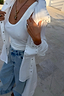 Thumbnail for White Studded Tie Back Shirt with silver stud detailing on the collar and cuffs, layered over a white ribbed tank.