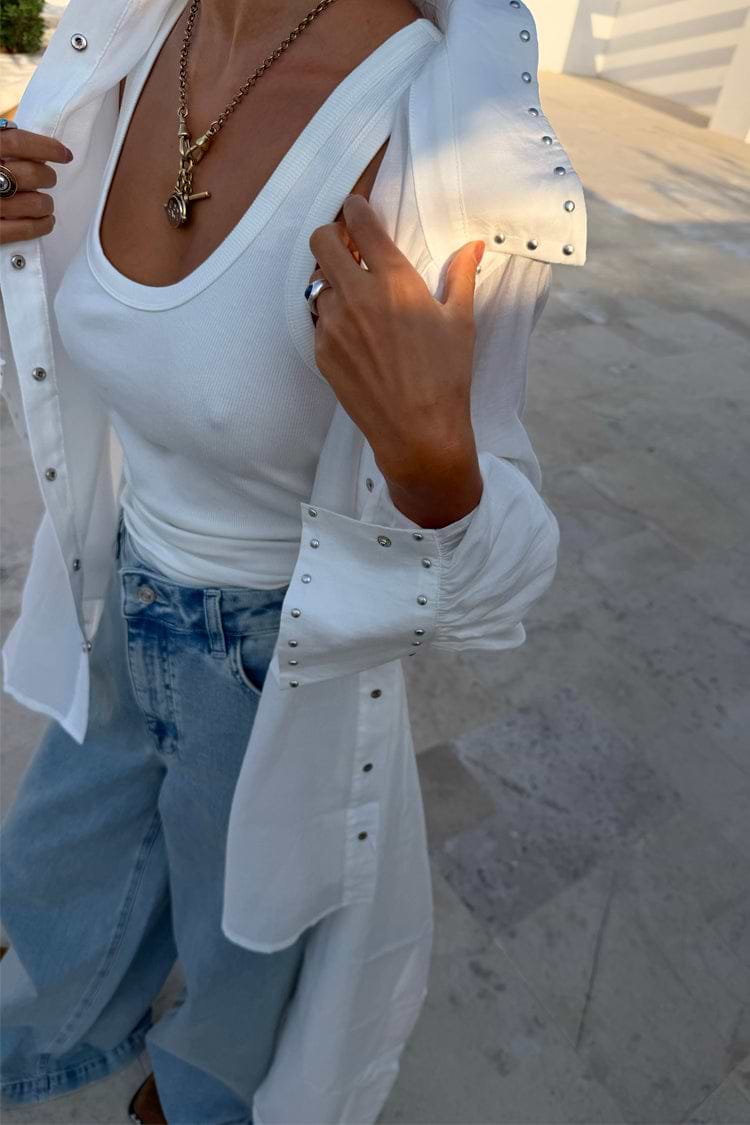 White Studded Tie Back Shirt with silver stud detailing on the collar and cuffs, layered over a white ribbed tank.