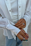 Thumbnail for White Studded Tie Back Shirt detail highlighting silver stud embellishments on the cuffs and front button fastening.