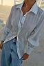White Studded Tie Back Shirt featuring silver studs on the collar and cuffs, styled with light-wash denim.